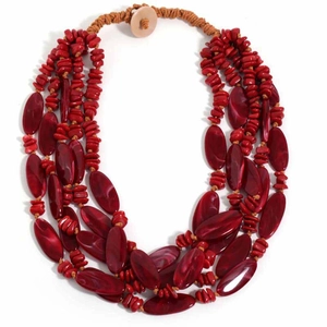 Close-up of multi-layer red acrylic beads and tribal stone chips with toggle closure