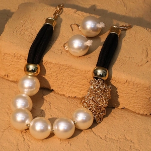 Statement layered faux pearl necklace with gold chain, black cord and matching earrings