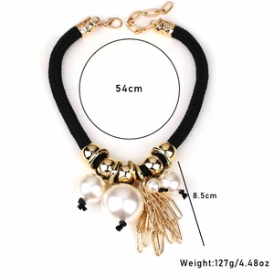 Chunky bohemian rope necklace with white pearls and gold pendants measuring 54cm long
