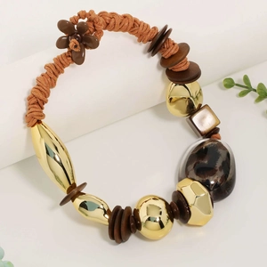 Bohemian gold and brown leopard print resin pendant necklace on woven rope cord