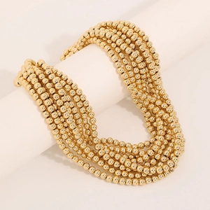 Multi-layer handmade beaded necklace in bright gold finish with round metallic beads