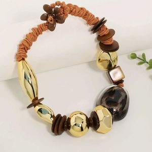 Bohemian gold and brown beaded necklace with leopard print resin bead and woven cord
