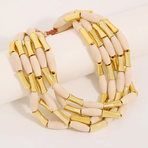 Elegant multi-layer necklace with cream wood beads and gold tubes in bohemian style