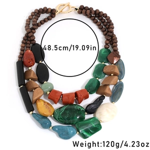 Detail view showing multi-layer wood beads and acrylic necklace with 48.5cm length mark