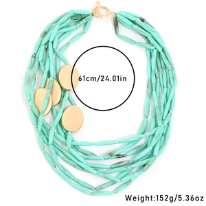 Multi-layer mint green acrylic long bar necklace with golden disc accents and toggle clasp