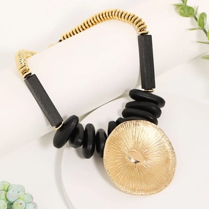 Ethnic wood and gold bead necklace with large lotus leaf sunburst pendant display