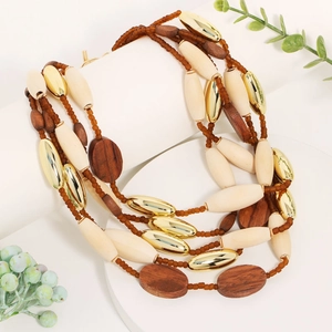 Bohemian multilayer necklace with ivory beads, brown wood elements and gold accents