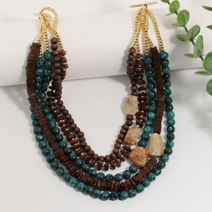 Multilayer bohemian necklace with turquoise beads, wood pieces and stone pendants