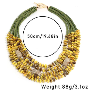Detail view of multi-layer beaded necklace with green beads and 50cm gold toggle clasp