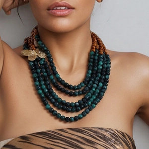 Bohemian multi-layer necklace with dark green beads, wood accents and gold butterfly