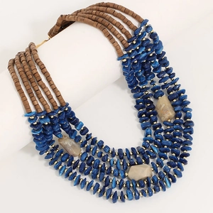 Bohemian five-layer beaded necklace featuring deep blue stones and wooden beads on a white stand