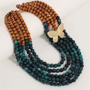 Multilayer beaded necklace with wood beads, turquoise stones and a golden butterfly