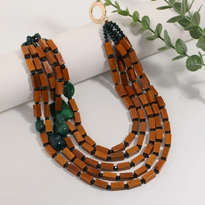 Bohemian multi-layer necklace with dark brown wood beads and green stone accents