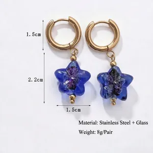 Handmade stainless steel hoop earrings with dark blue glass star charms and floral texture