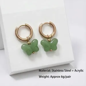 Gold stainless steel hoop earrings featuring sweet green acrylic butterfly charms