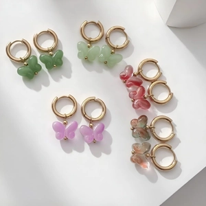 Five pairs of colorful resin butterfly charms on 18K gold-plated stainless steel hoop earrings