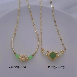 Golden necklaces with green cat-eye stone pendants and 45+5cm length measurements