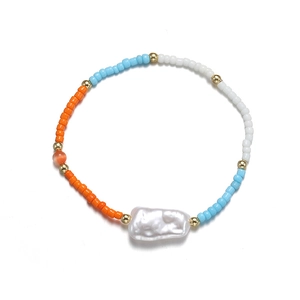 Bohemian colorful seed bead bracelet with white baroque pearl and golden accents