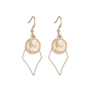 Detail view of vintage gold coin earrings with portrait relief and geometric charms