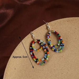 Bohemian handmade colorful beaded earrings with oval hoop design measuring approx 5cm