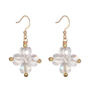 Detail of pink crystal flower earrings with gold hooks and heart shaped petals
