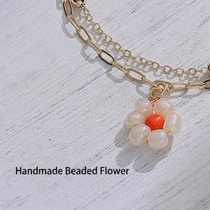 14K gold plated double layer stainless steel bracelet with handmade white pearl flower charm