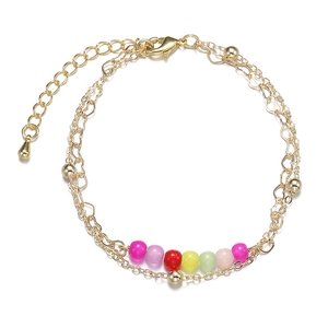 Double-layered gold chain bracelet with colorful matte beads and adjustable clasp