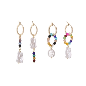 Asymmetric gold hoop earrings with baroque pearls and colorful beads on white background