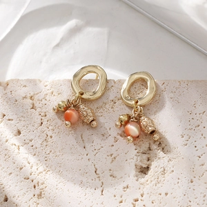 Boucles d'oreilles vintage à œil de chat avec anneaux dorés à texture délicate