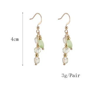 Vintage cat eye stone earrings with clear crystals and golden hooks, 4cm long
