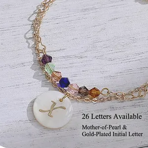 Double-layered 14K gold-plated stainless steel bracelet with colorful beads and shell letter X