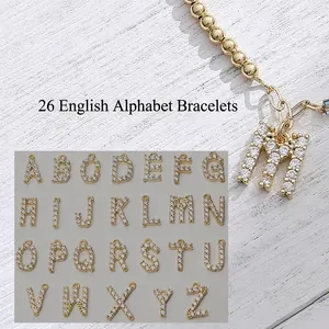 Gold beaded bracelet with sparkling diamond letter M pendant and full A-Z alphabet options