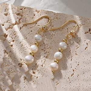 Elegant vintage pearl drop earrings with 18k gold plated beads and fishhook closure