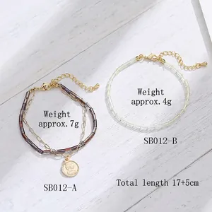 Double-layered gold chain bracelet with coin pendant and colorful acrylic beads