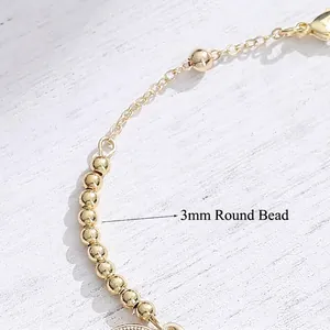 Bracciale punk con moneta regina double-face e perle rotonde dorate da 3mm lucide