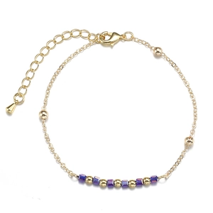 Bracelet en acier inoxydable doré avec perles d'or et pierres cubiques violettes alternées