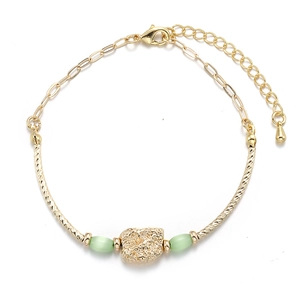 Gold pleated bracelet with irregular textured pendant and green cat eye stone accents