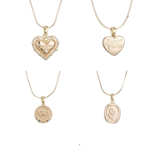 Collection of four 14K gold plated titanium necklaces with heart and flower pendants