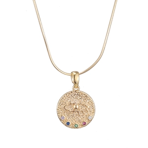 Close-up of a 14K gold coin pendant featuring Evil Eye and five multi-color crystals