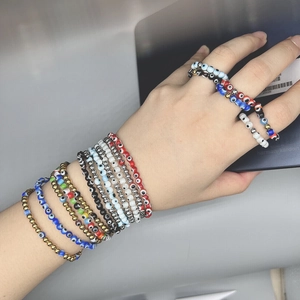 Elastic Evil Eye beaded bracelets set with colorful resin eyes and golden metal beads