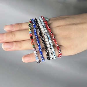 Evil Eye beaded elastic bracelet set for women featuring multiple vibrant colors