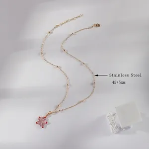 Pink peach blossom pendant necklace in gold stainless steel with bead chain detail