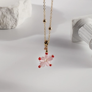 Pink peach blossom necklace in titanium steel with gold chain and flower pendant