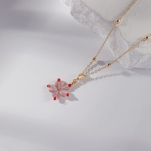 Pink peach blossom necklace with gold bead chain and flower pendant in stainless steel