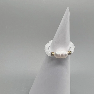 Detail of beaded elastic ring with baroque freshwater pearl and gold spacer beads