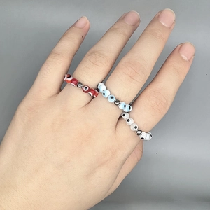 Three-piece evil eye beaded ring set with elastic blue and red charm beads for women