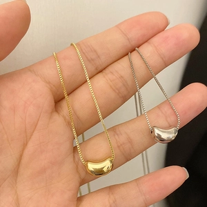 Minimalist bean pendant necklace in gold and silver finish with fine box chain