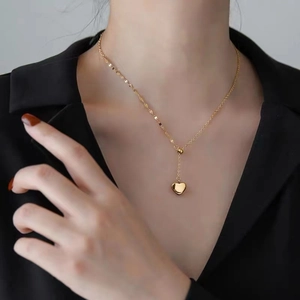 18K gold plated titanium steel heart pendant necklace with Y-shape tassel on a model