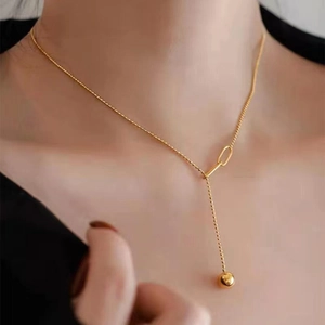 18K gold plated titanium steel heart tassel necklace on model showing drop length and luster