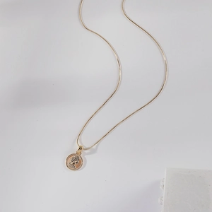 Elegant 18K gold-plated snake chain necklace with a vintage coin pendant for women
